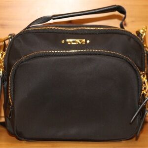 Tumi Black Nylon Crossbody with Gold Accents never used